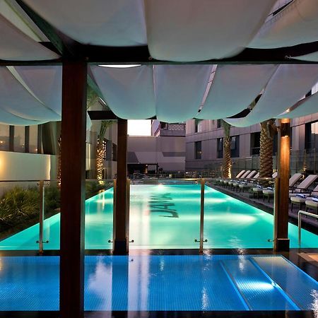Damac Maison The Vogue Дубай Екстер'єр фото The pool at the hotel