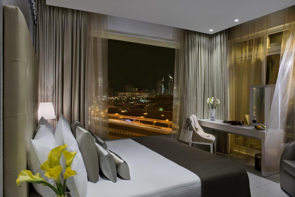 Damac Maison The Vogue Дубай Екстер'єр фото A room at the hotel