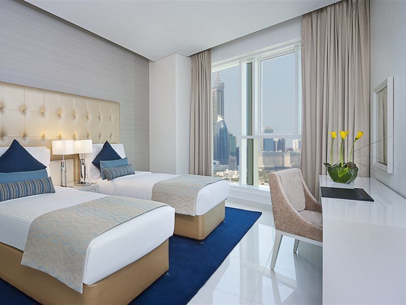 Damac Maison The Vogue Дубай Екстер'єр фото A guest room at the Address Downtown Hotel