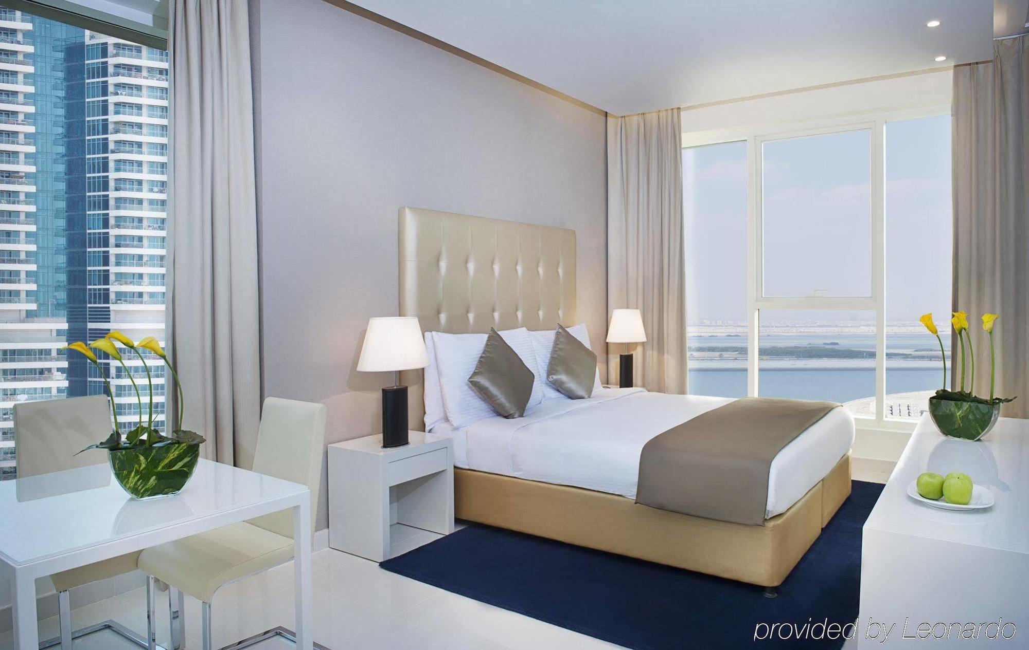 Damac Maison The Vogue Дубай Екстер'єр фото A bedroom at the Address Downtown Hotel