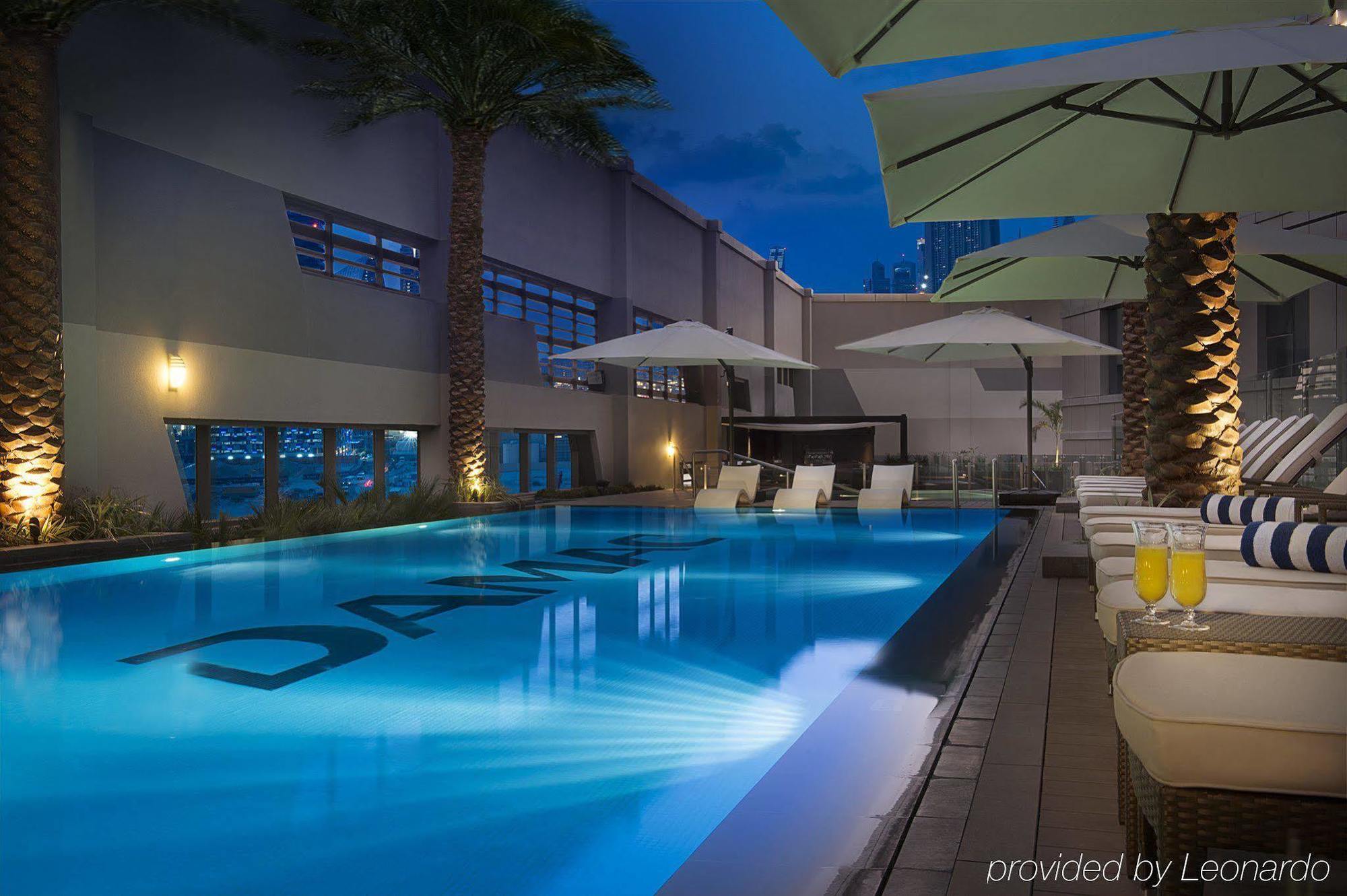 Damac Maison The Vogue Дубай Екстер'єр фото The pool at the hotel