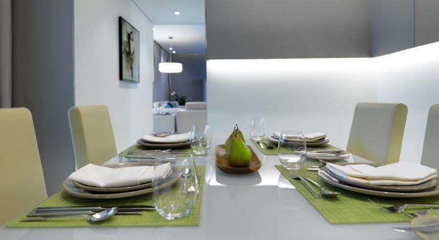 Damac Maison The Vogue Дубай Екстер'єр фото A table set for a meal