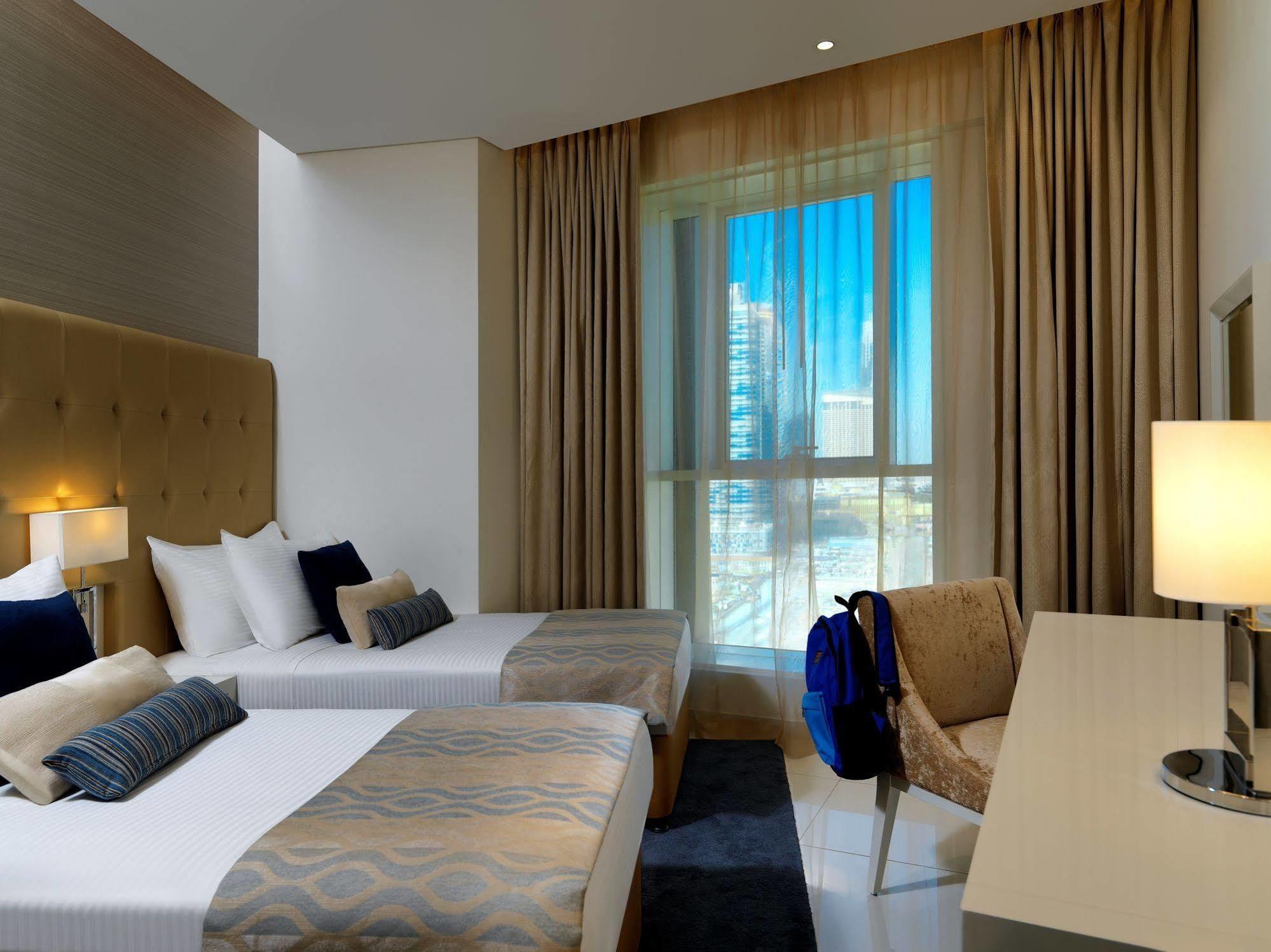 Damac Maison The Vogue Дубай Екстер'єр фото A room at the hotel